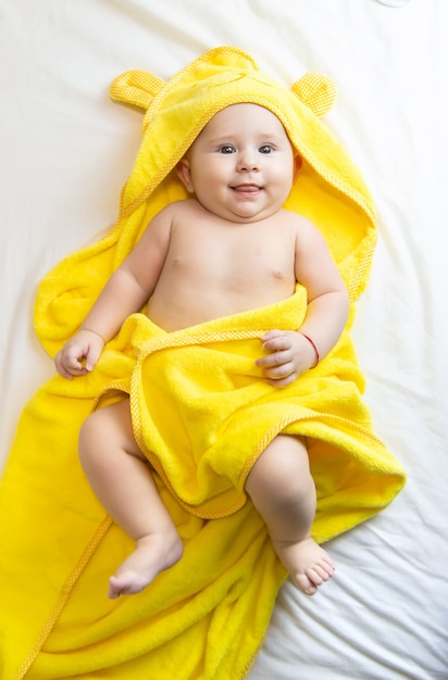 Little baby in a towel after bathing