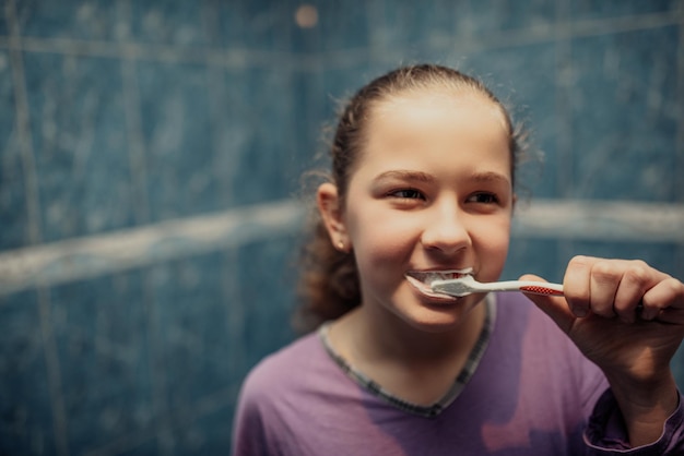 Little beautiful girl brushing teeth healthy concept