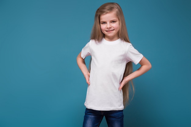 Little beauty girl in tee shirt with long brown hair