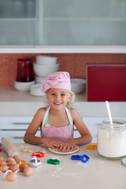 Little blond girl smiling at camera