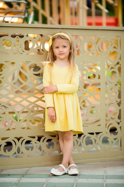 Little blonde girl in amusement park