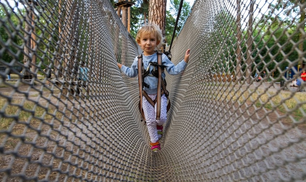 Little blonde girl having fun in the playground