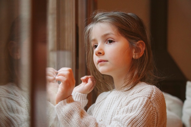 Little blonde girl waiting for santa at christmas eve