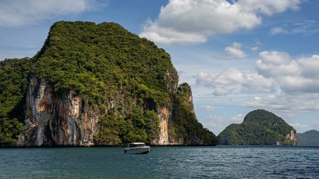 Little boat swimming back from calm lagoon