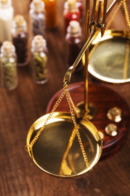 Little bottles with spices and scales on the table