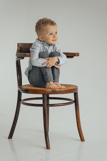 Little boy 4 years old blond in a shirt