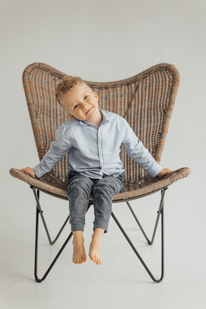 Little boy 4 years old blond in a shirt