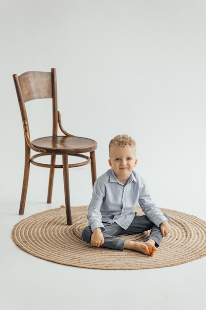 Little boy 4 years old blond in a shirt