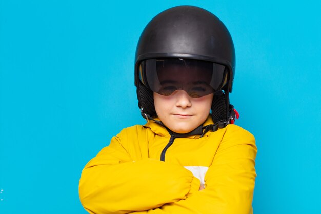 Photo little boy angry expression. motorbike helmet concept