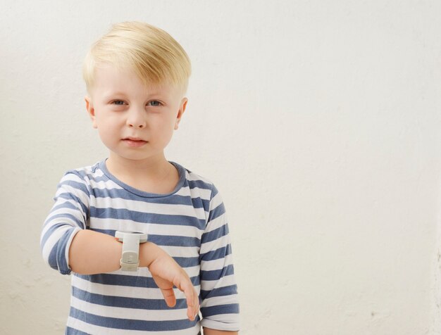 little boy brushing his teeth