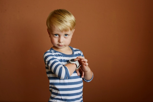 little boy brushing his teeth