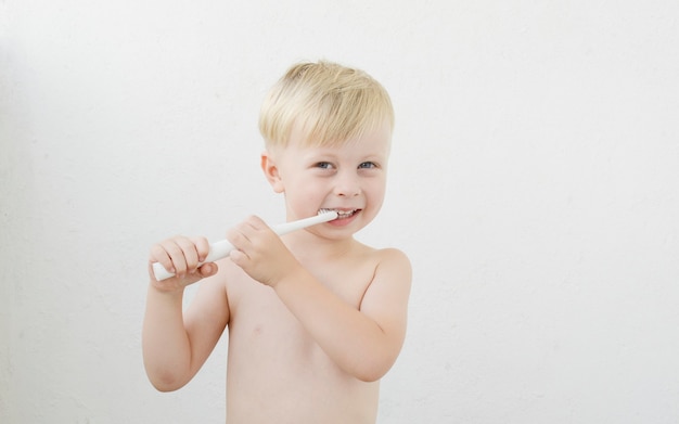 little boy brushing his teeth