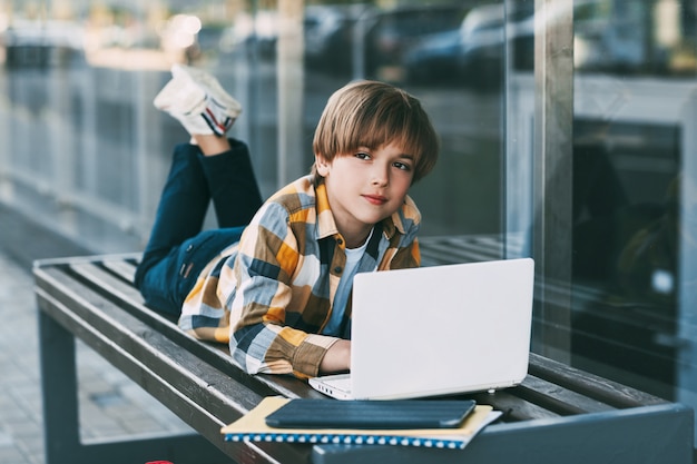 Little boy communicating through his computer