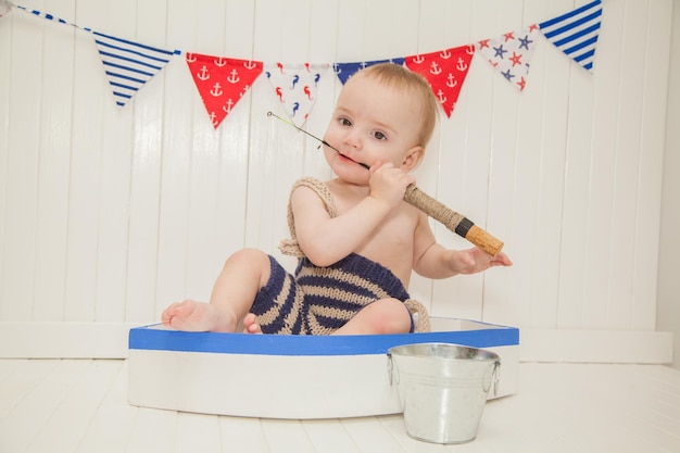 Little boy dressed as a fisherman on a boat halloween baby costume