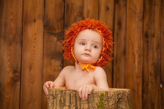 Little boy dressed as a lion cub halloween baby costume