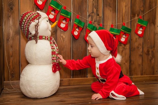 Little boy dressed as Santa Claus