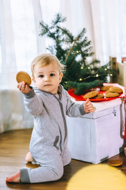 little boy eating biscuits with milk