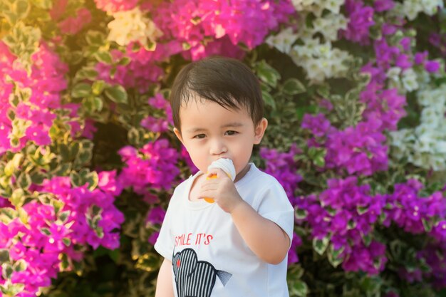 little boy enjoying a melting ice cream cone