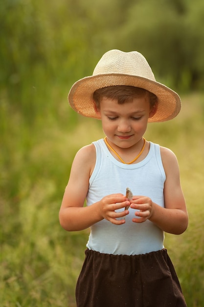 little boy fishing with a rod