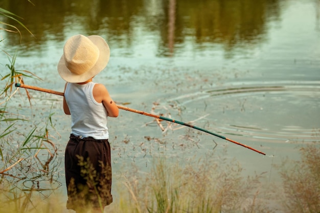 little boy fishing with a rod