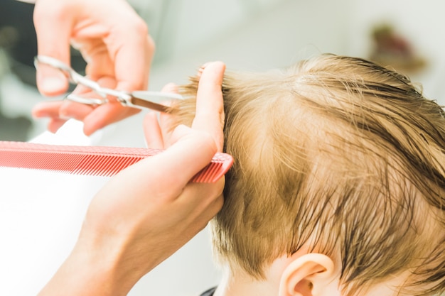 little boy in a hairdressing salon