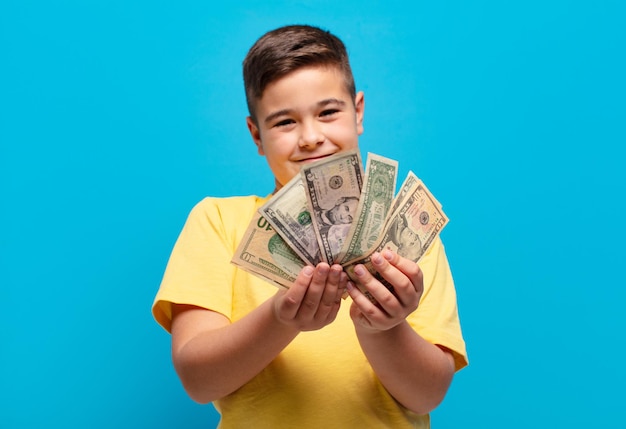 little boy happy expression with dollar banknotes