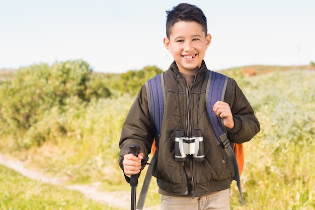 Little boy hiking in the mountains