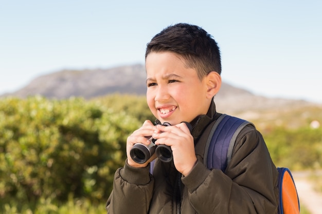 Little boy hiking in the mountains