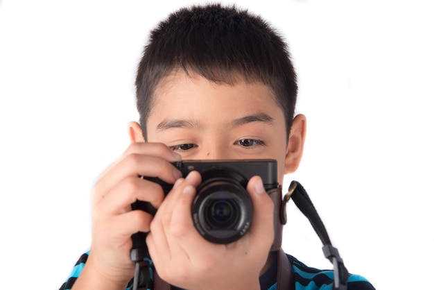Little boy holding camera