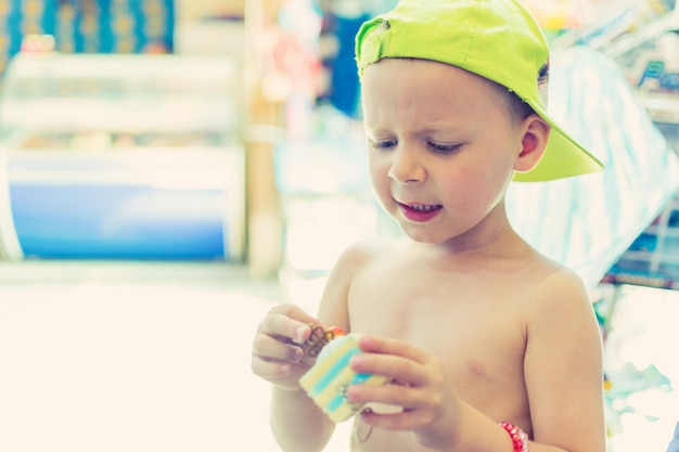 The little boy holds a toy