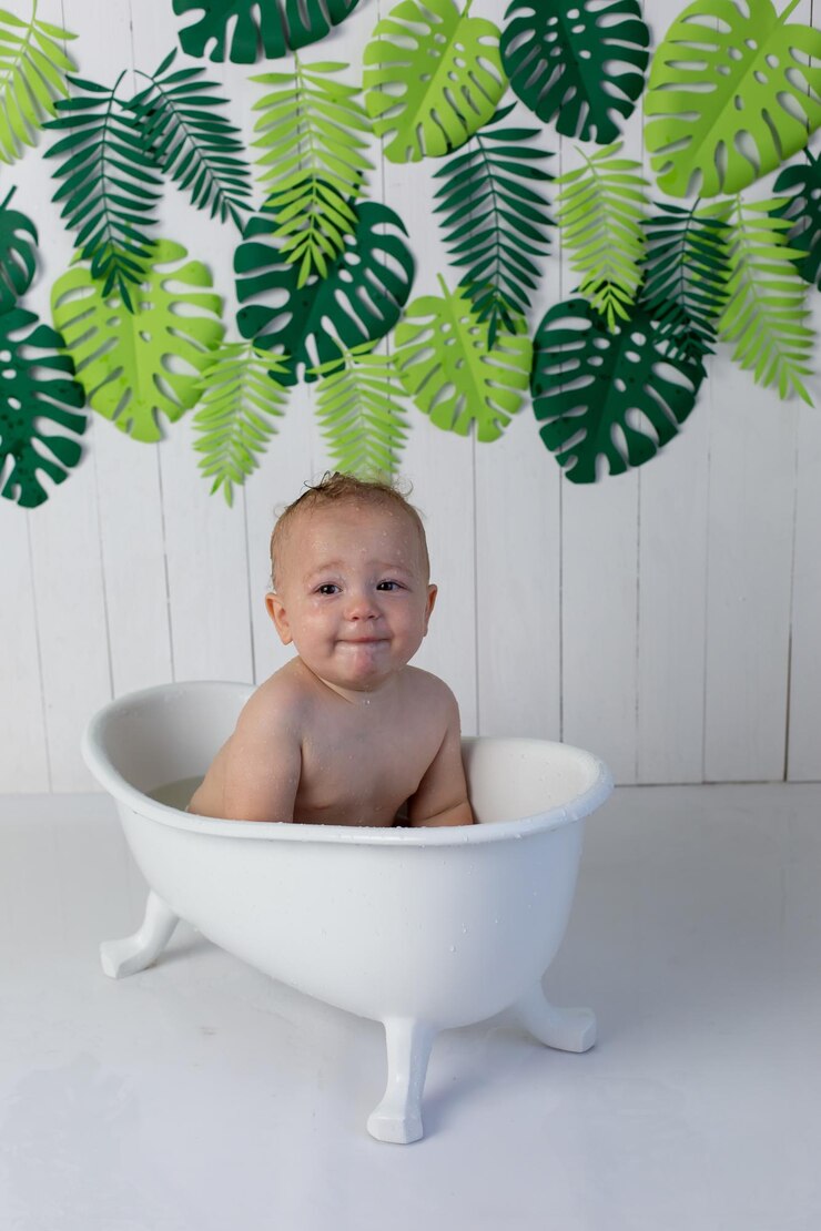 a little boy is bathing in the bath cute baby