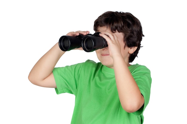 Little boy looking through binoculars isolated on white background