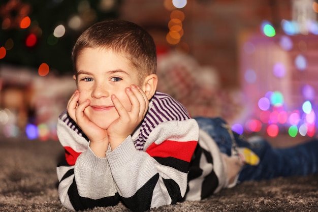 Little boy lying at home