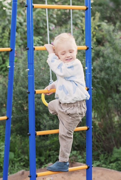 Little boy on playground on summer day