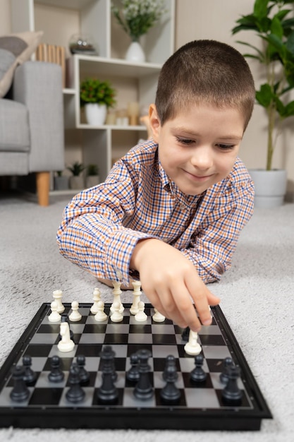 Little boy playing chess Board games for children