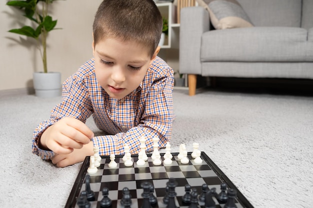 Little boy playing chess Board games for children