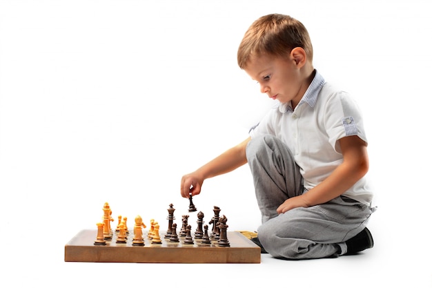 Little boy playing chess