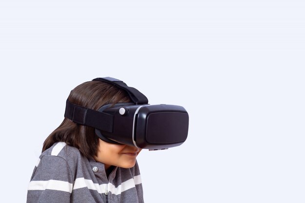 Little boy playing video games with VR.