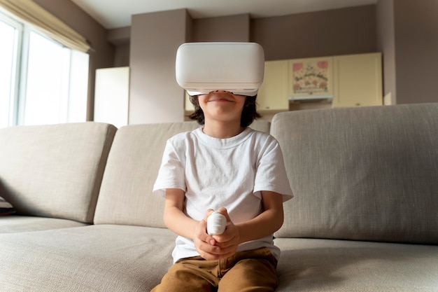 Little boy playing a virtual reality game