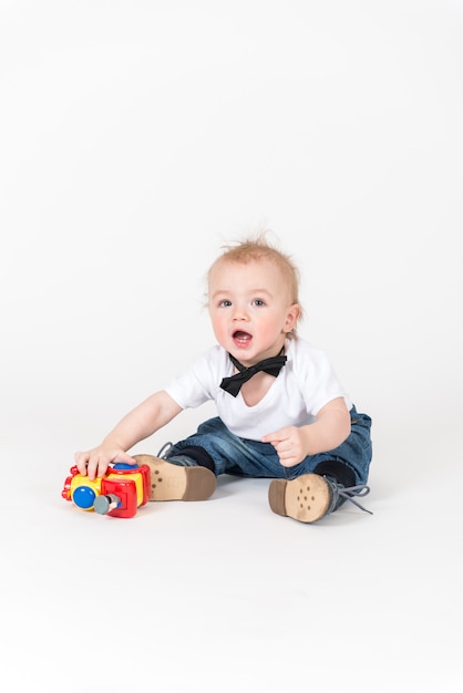 Little boy playing with a train toy