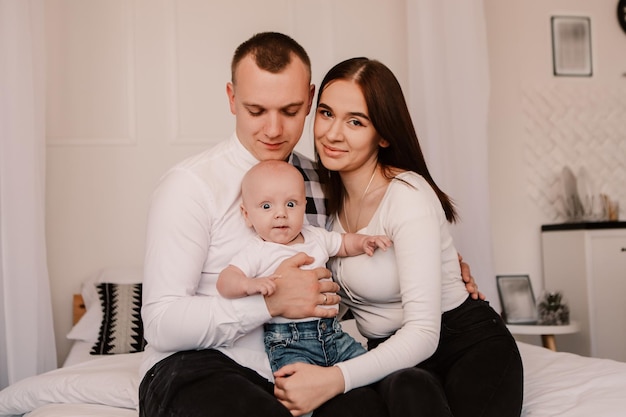 Little boy pop-eyed surprised cute child baby playing with parents. Playful shocked toddler