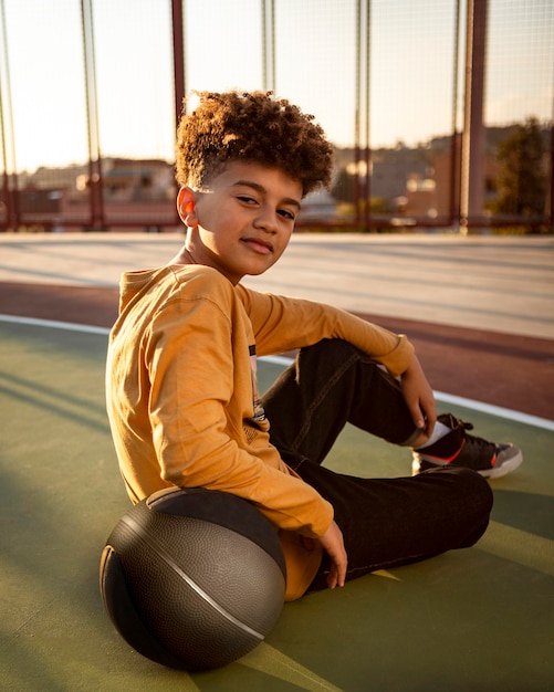 Little boy posing with a basketball