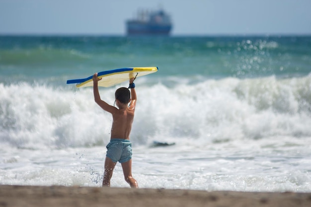 Little boy ready to surfing