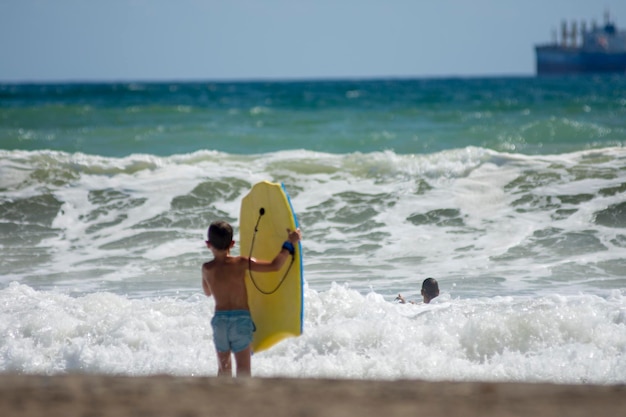 Little boy ready to surfing