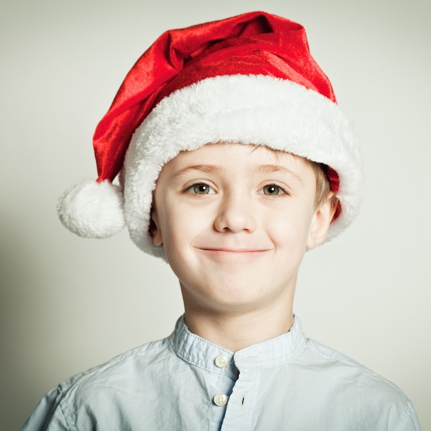 Little boy in Santa Claus hat