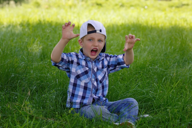 Little boy showing a growling tiger