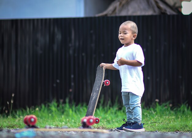 Little boy on skate board.