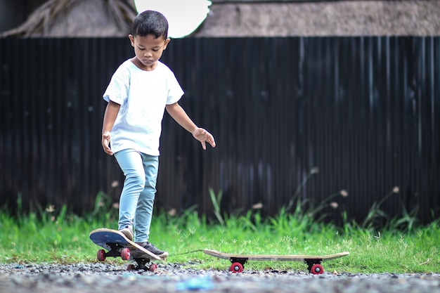 Little boy on skate board.