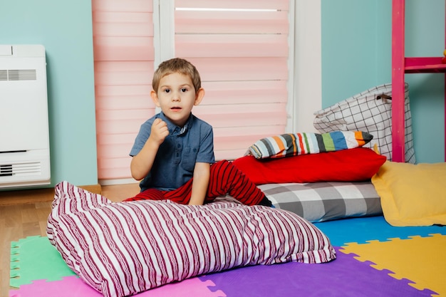 Little boy sleeping while nap time at the kindergarten