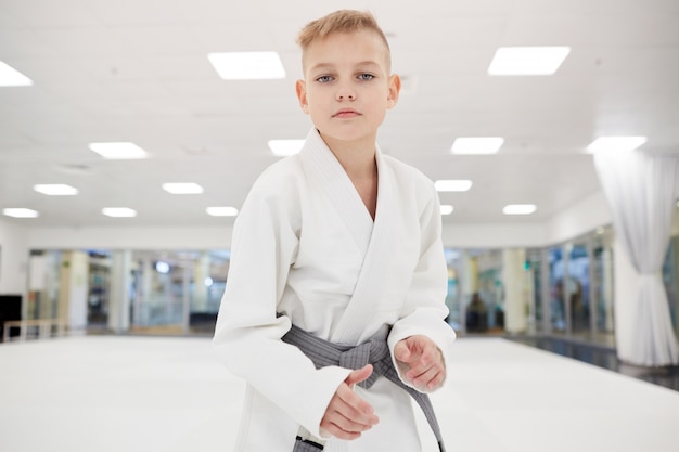 little boy standing in kimono